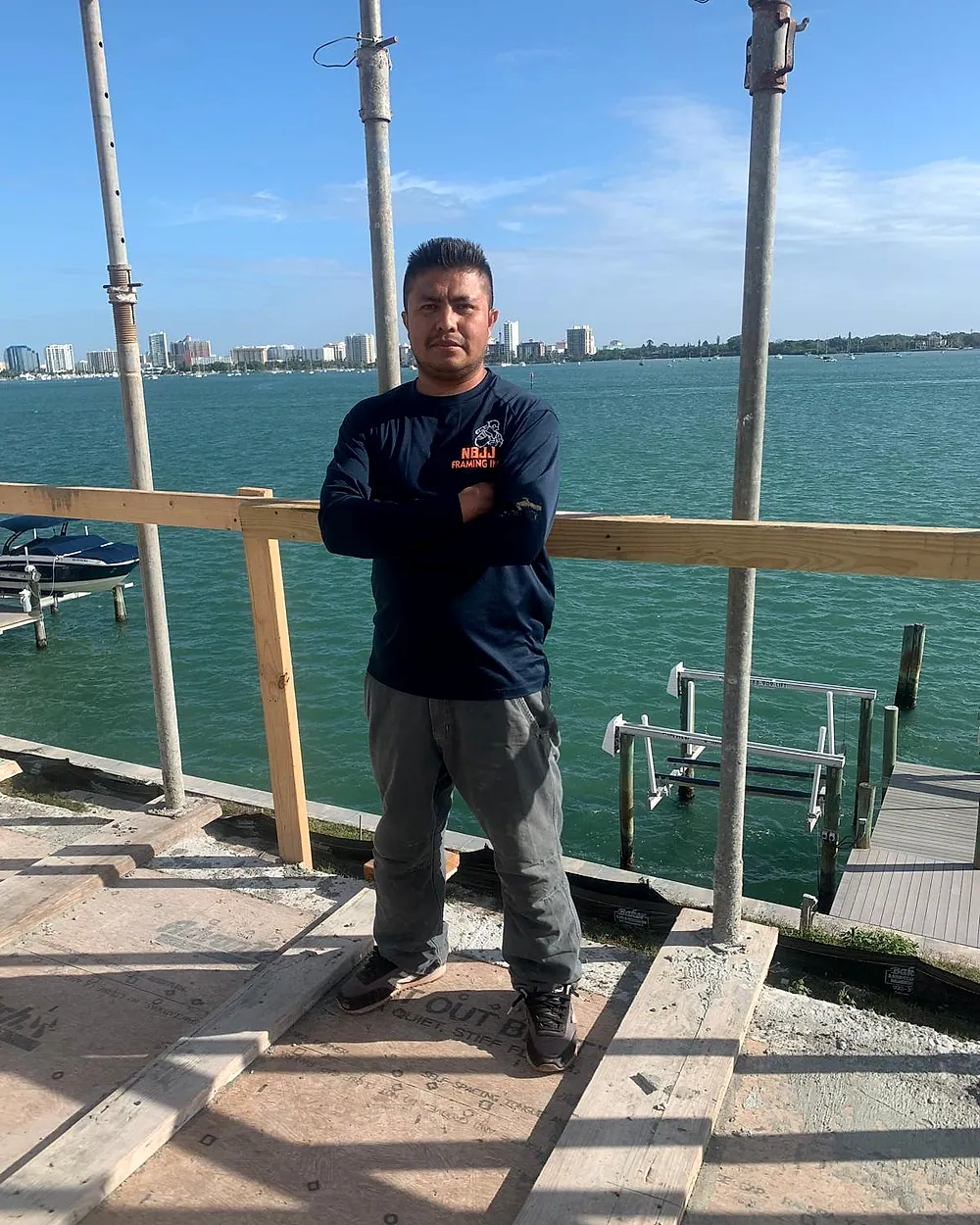 NBJJ Framing team member at a waterfront job site
