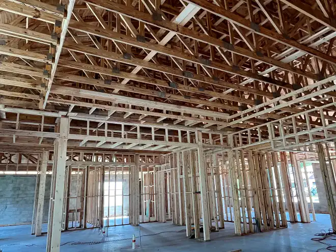 Interior wood stud walls and floor trusses framed inside a Central Florida commercial building