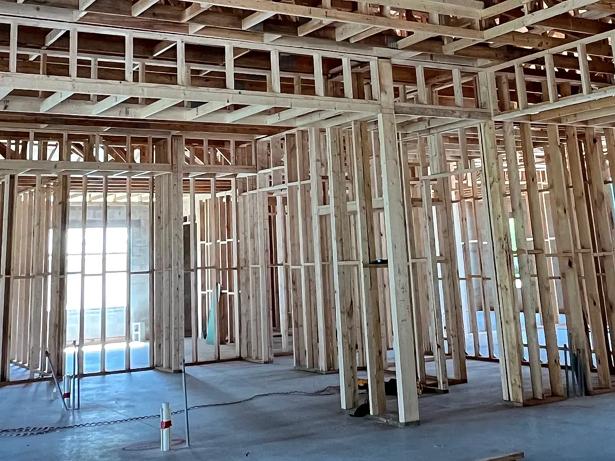 Framing levels and tools on the concrete slab of a job site